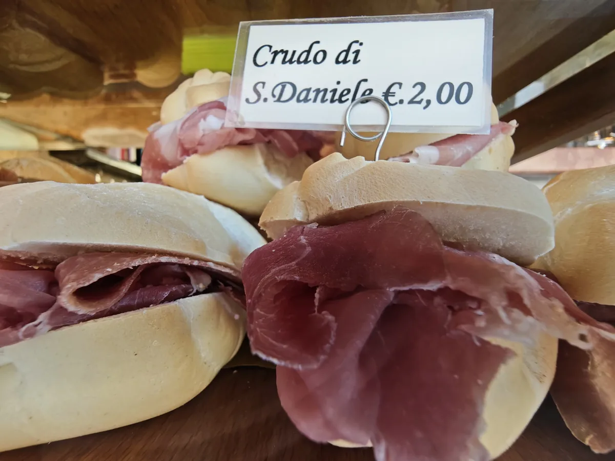 Cicchetto with San Daniele raw ham in a soft roll, 2 euro, at the Al Mercà bacaro near the Rialto market in Venice