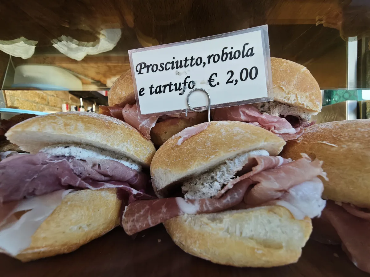 Cicchetto with ham, robiola cheese and truffle, 2 euro, at the Al Mercà bacaro near the Rialto market in Venice