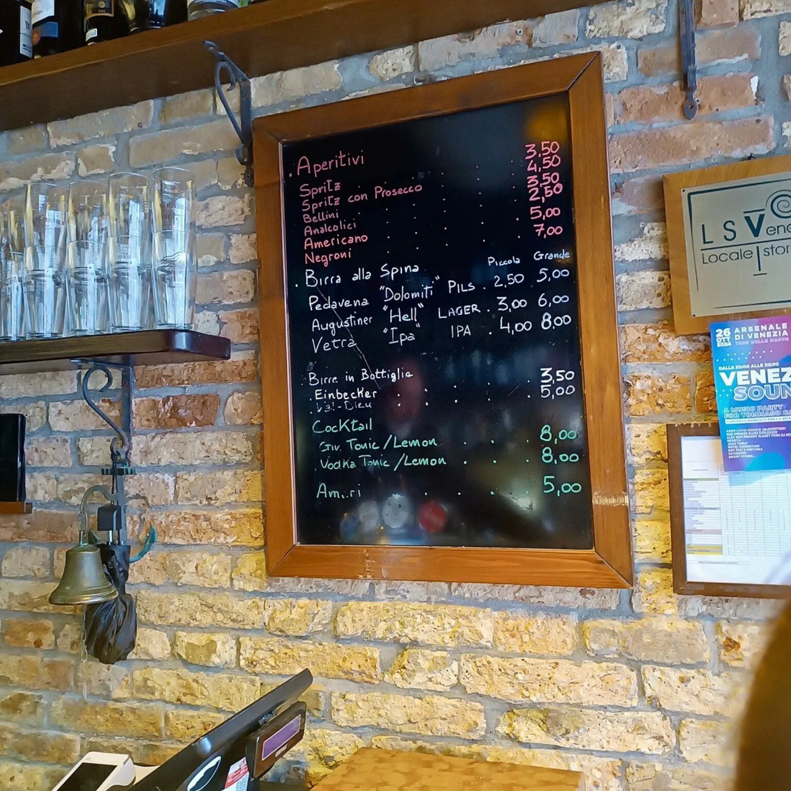 The chalkboard with prices for ombre and aperitivi at Al Mercà